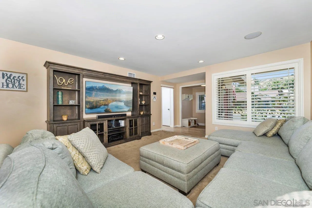 13317 Arikara Drive Poway, CA 92064 - Photo 11 of 52 a living room with furniture and a flat screen tv
