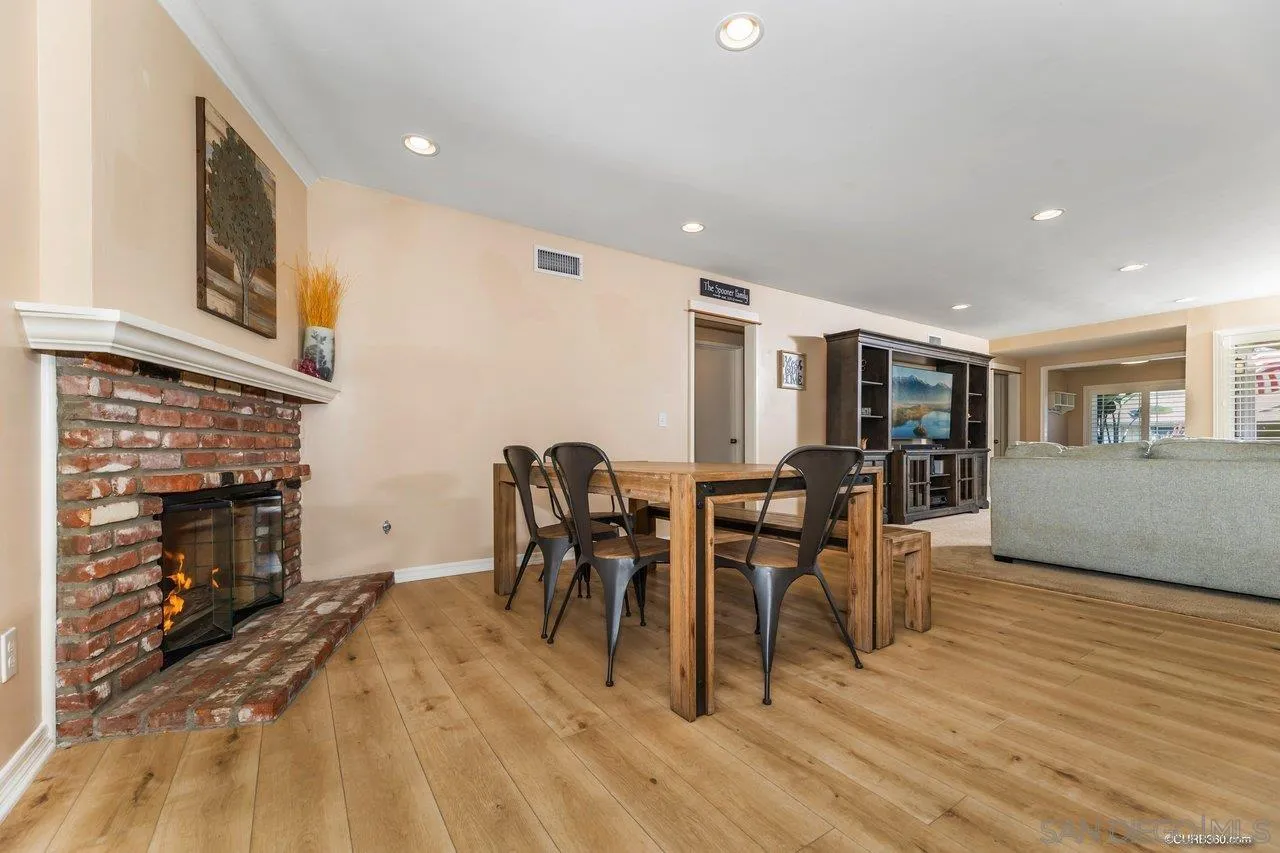 13317 Arikara Drive Poway, CA 92064 - Photo 14 of 52 a dining room with furniture and wooden floor