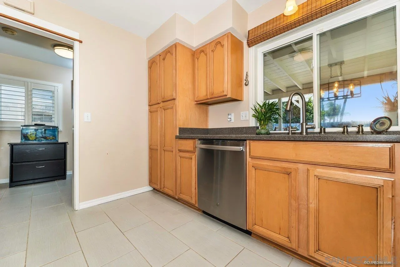 13317 Arikara Drive Poway, CA 92064 - Photo 20 of 52 a kitchen with stainless steel appliances a sink and a refrigerator