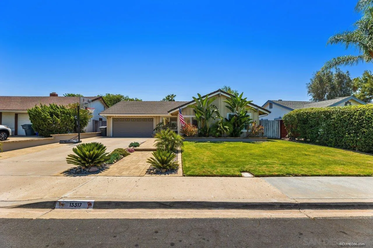 13317 Arikara Drive Poway, CA 92064 - Photo 2 of 52 a front view of a house with a yard