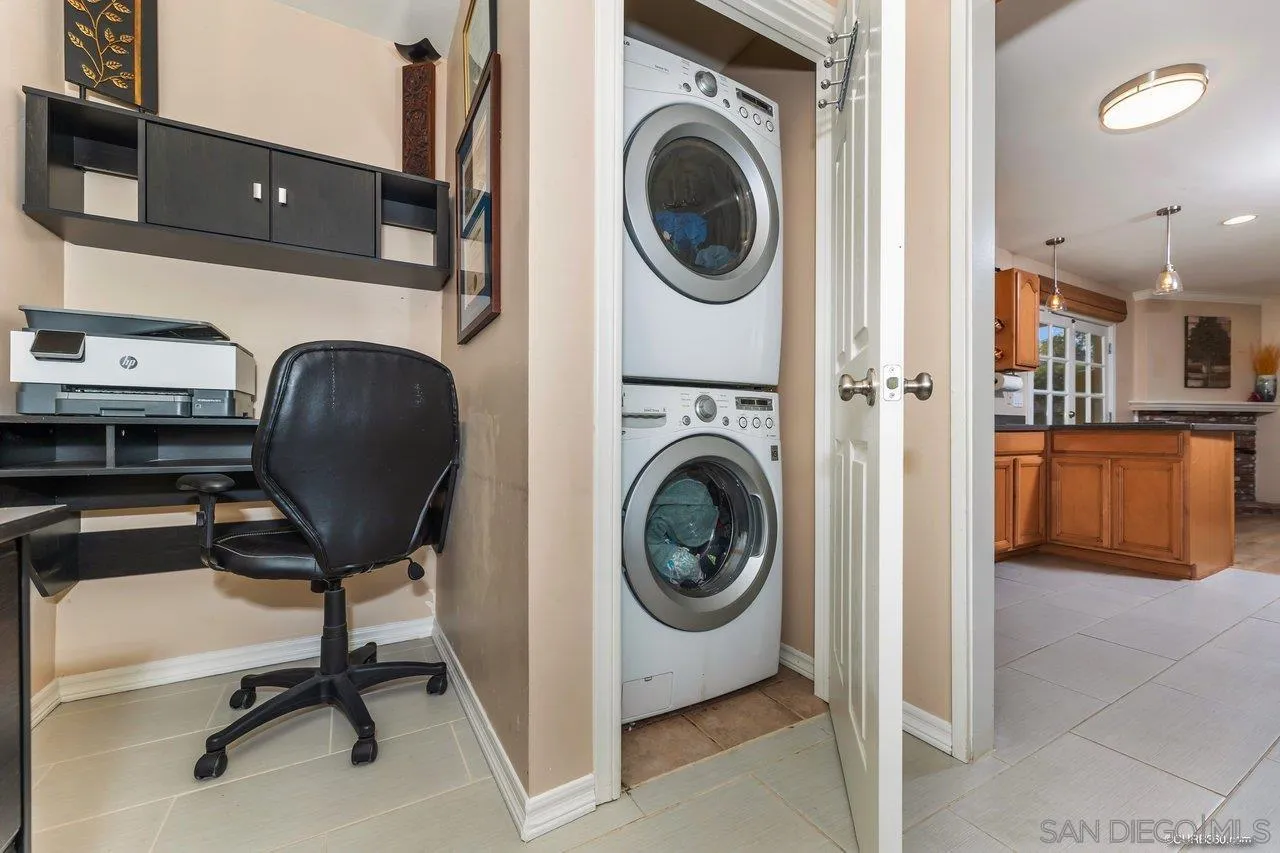 13317 Arikara Drive Poway, CA 92064 - Photo 22 of 52 a view of a workspace with furniture and a fireplace