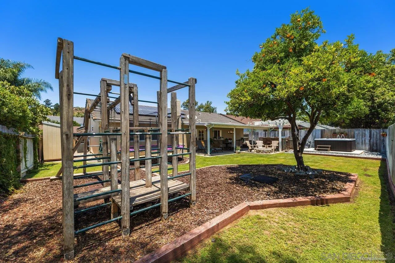 13317 Arikara Drive Poway, CA 92064 - Photo 27 of 52 a front view of a house with swimming pool yard and outdoor seating