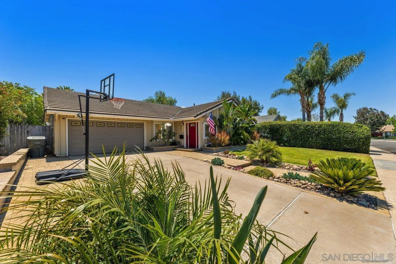 13317 Arikara Drive Poway, CA 92064 - Photo 3 of 52 a front view of a house with a yard