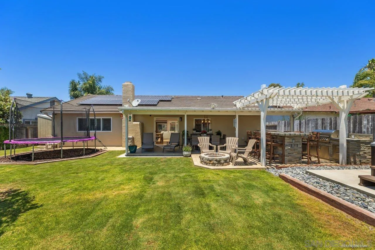 13317 Arikara Drive Poway, CA 92064 - Photo 31 of 52 a view of a house with patio swimming pool and sitting area