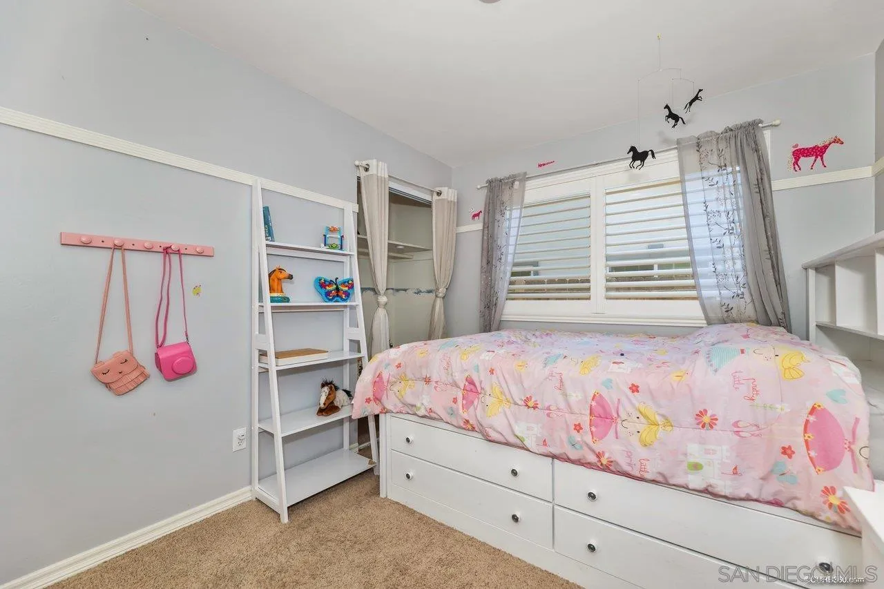 13317 Arikara Drive Poway, CA 92064 - Photo 32 of 52 a bedroom with a bed and a window