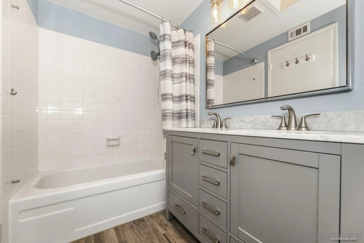 13317 Arikara Drive Poway, CA 92064 - Photo 33 of 52 a bathroom with a tub sink and mirror