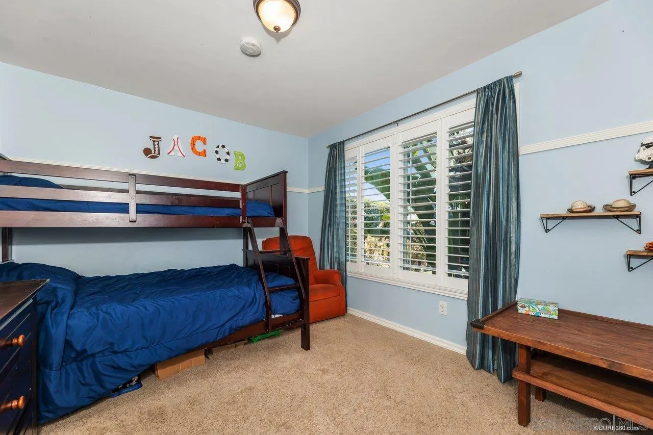 13317 Arikara Drive Poway, CA 92064 - Photo 34 of 52 a bedroom with furniture and a window