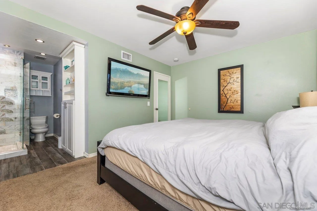 13317 Arikara Drive Poway, CA 92064 - Photo 38 of 52 a bedroom with a bed and a painting on the wall