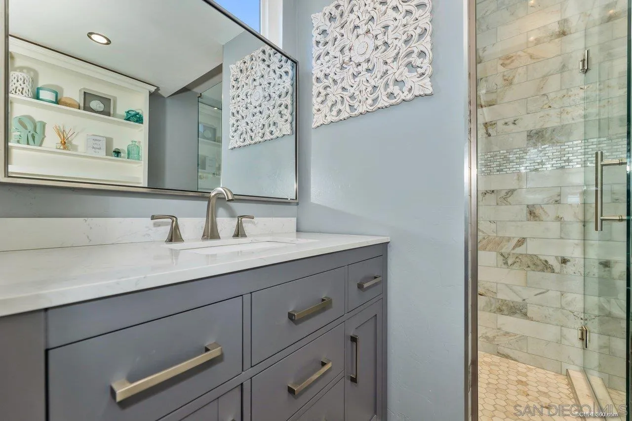 13317 Arikara Drive Poway, CA 92064 - Photo 39 of 52 a bathroom with a sink and a mirror
