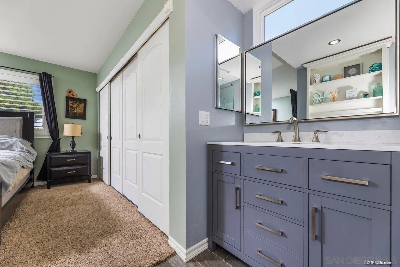 13317 Arikara Drive Poway, CA 92064 - Photo 41 of 52 a en suite bathroom with a granite countertop sink and a mirror