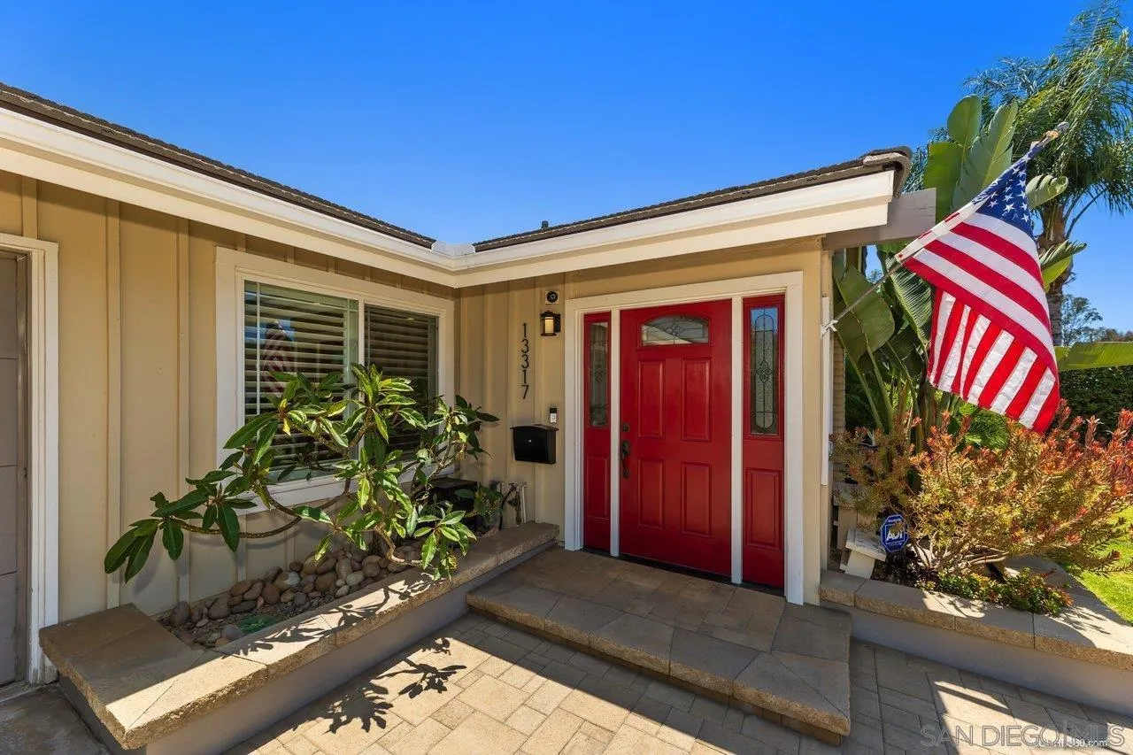 13317 Arikara Drive Poway, CA 92064 - Photo 6 of 52 a front view of a house with a yard
