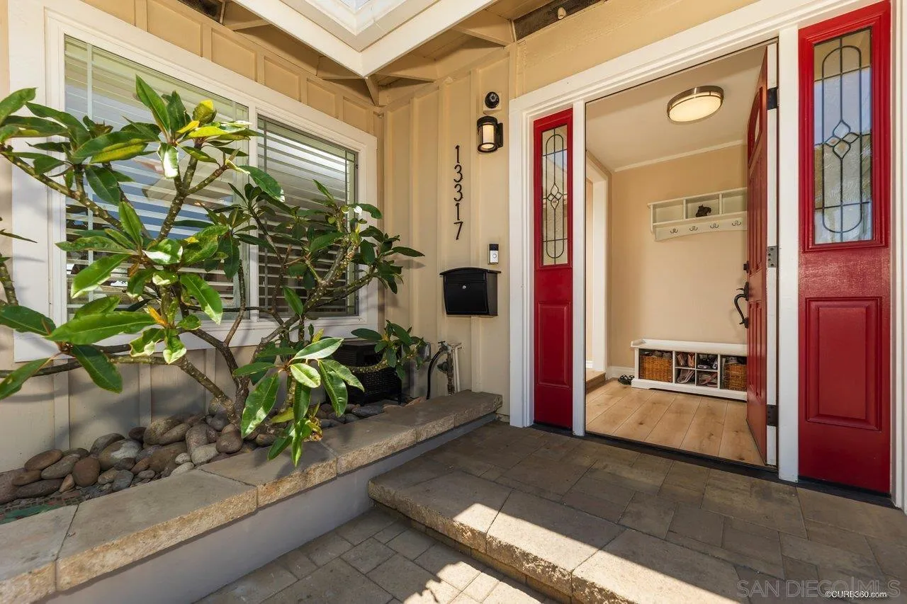 13317 Arikara Drive Poway, CA 92064 - Photo 7 of 52 a front view of a house with a garden