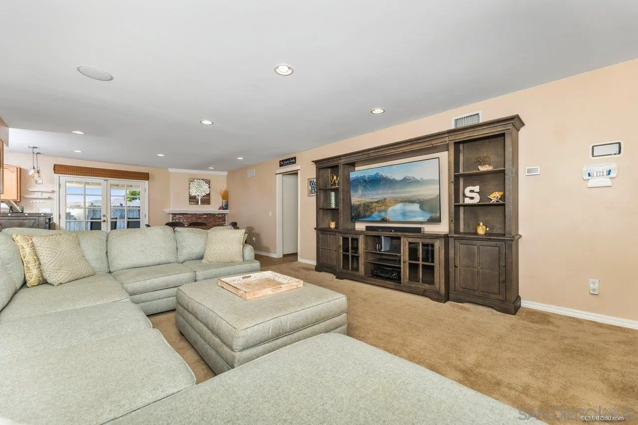 13317 Arikara Drive Poway, CA 92064 - Photo 9 of 52 a living room with furniture and a flat screen tv