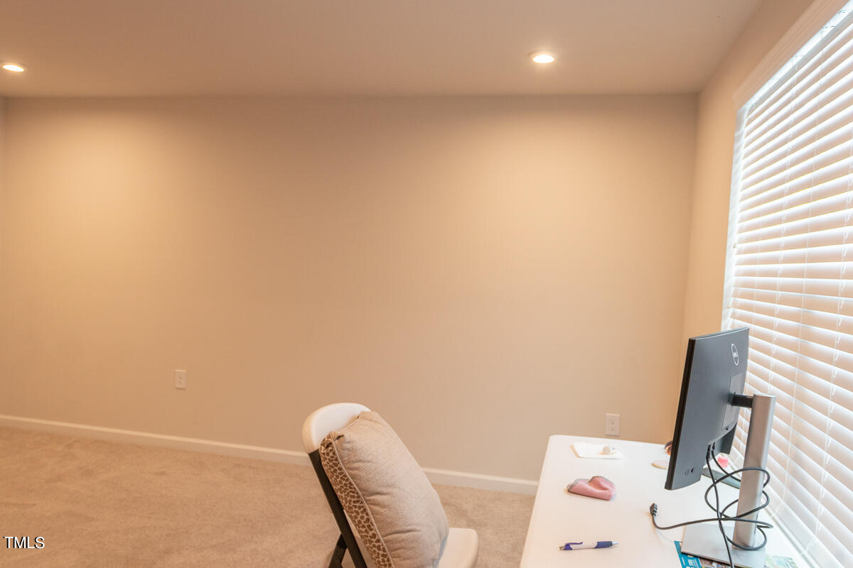 1505 Newpoint Drive Durham, NC 27713 - Photo 15 of 48 a workspace with furniture and a window