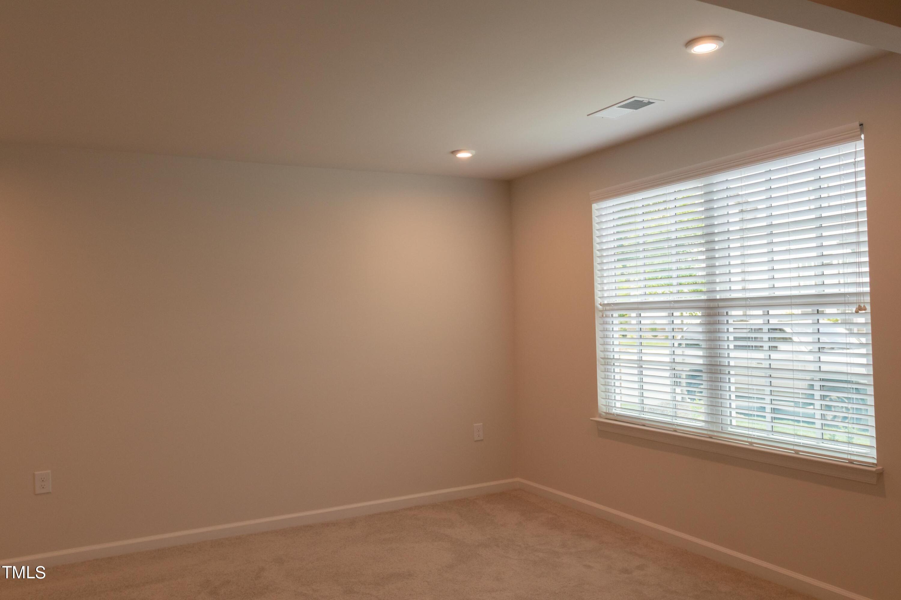 1505 Newpoint Drive Durham, NC 27713 - Photo 17 of 48 an empty room with a window