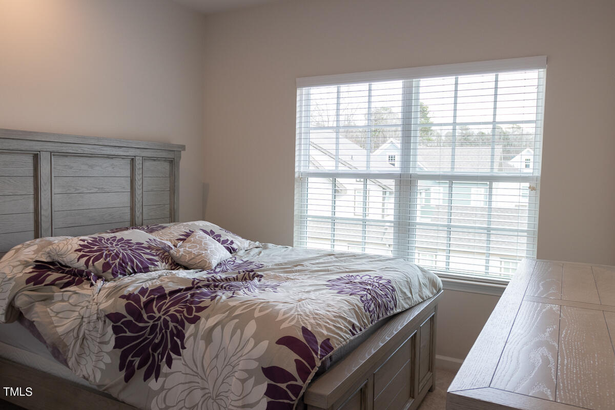 1505 Newpoint Drive Durham, NC 27713 - Photo 20 of 48 a bedroom with a bed and a window