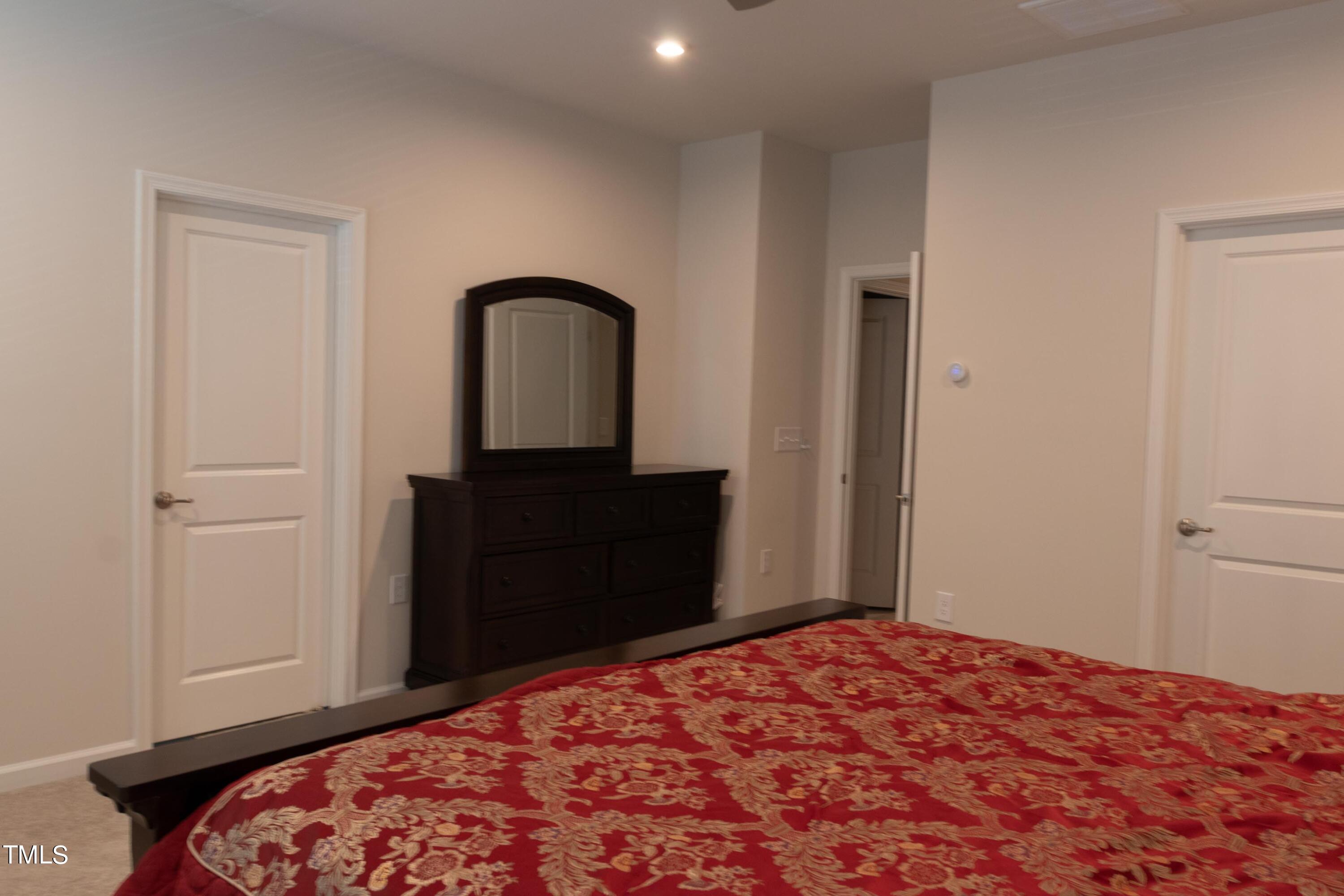 1505 Newpoint Drive Durham, NC 27713 - Photo 26 of 48 a bedroom with a bed and a dresser