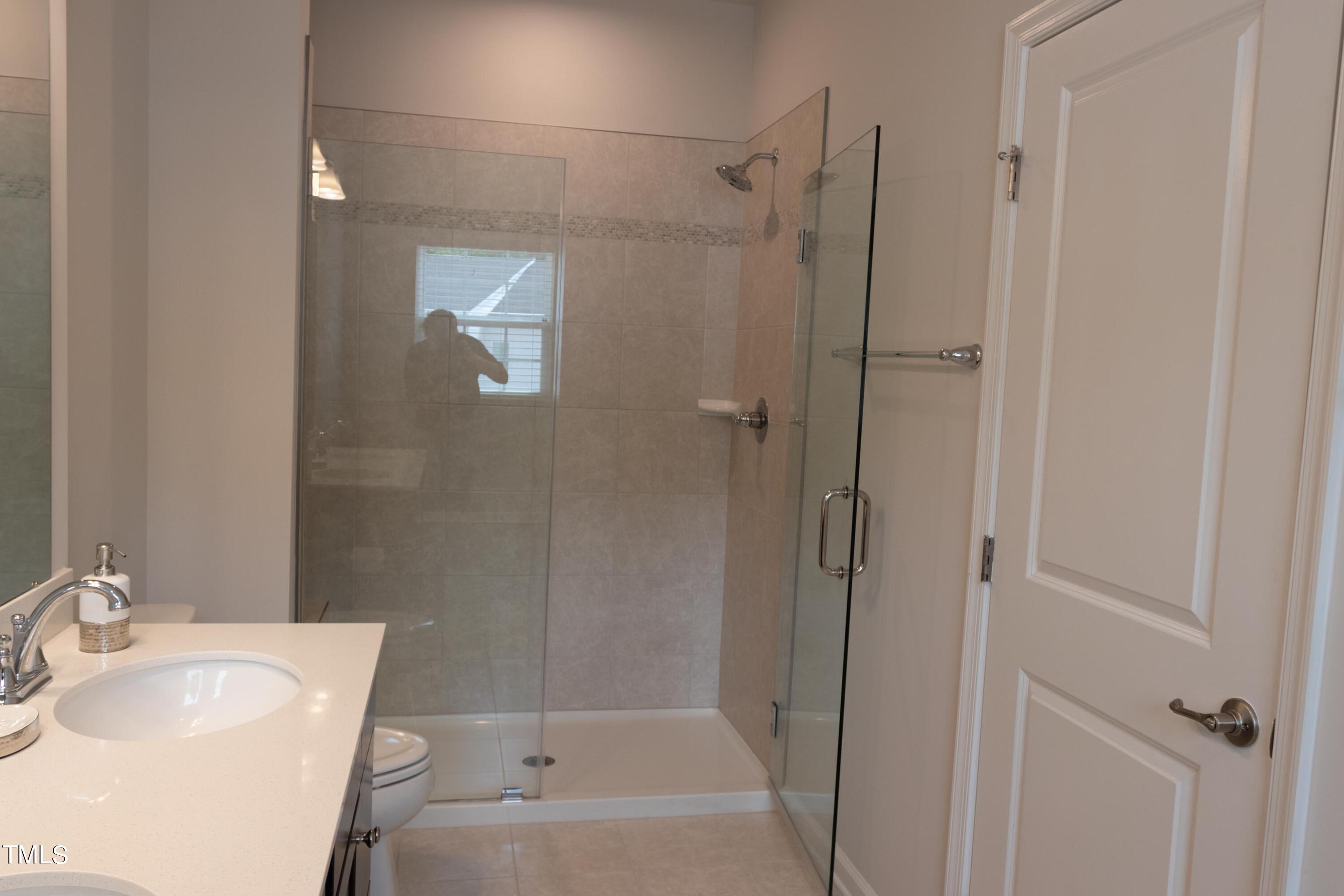 1505 Newpoint Drive Durham, NC 27713 - Photo 29 of 48 a bathroom with a sink toilet and shower