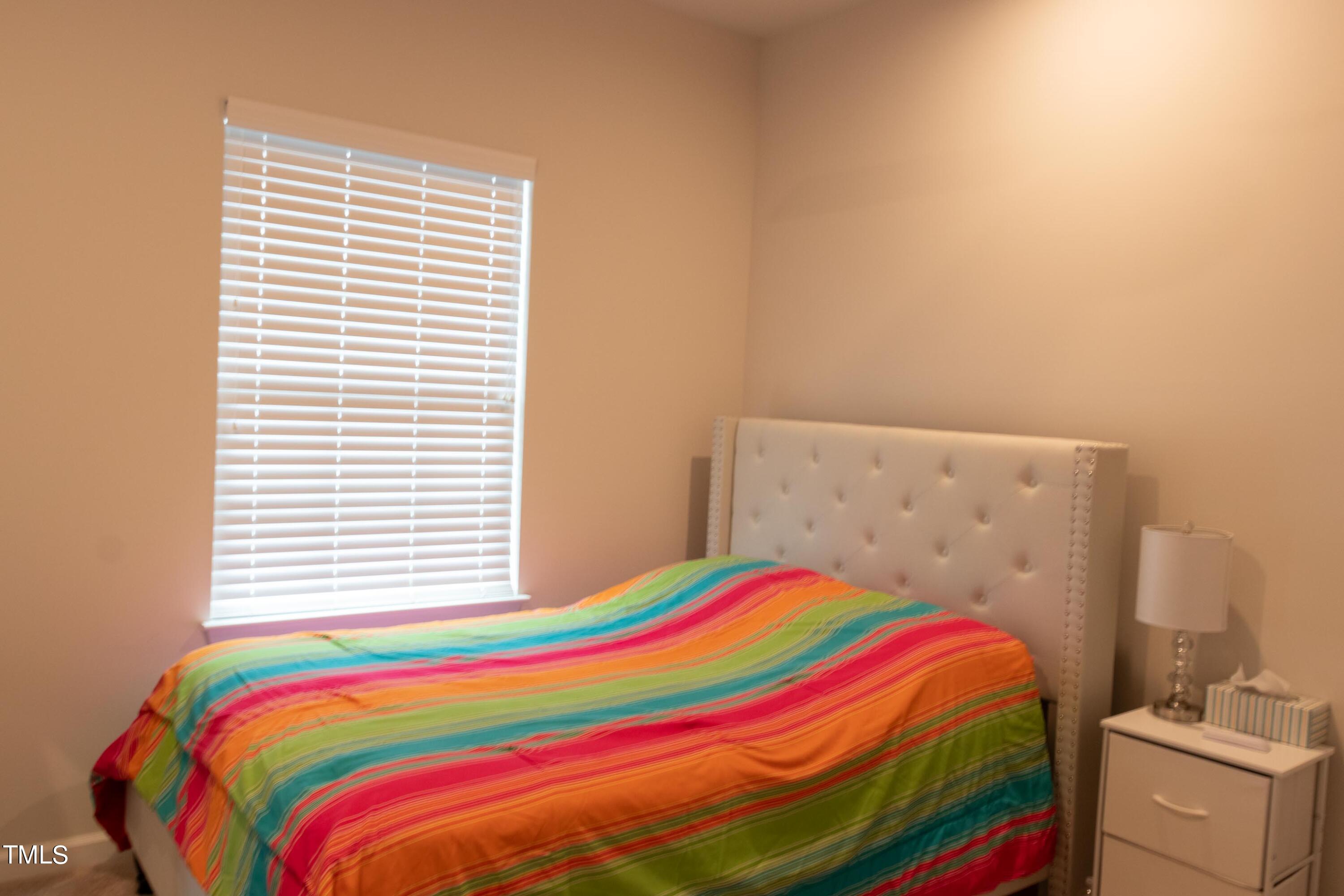 1505 Newpoint Drive Durham, NC 27713 - Photo 30 of 48 a bedroom with a bed and a window