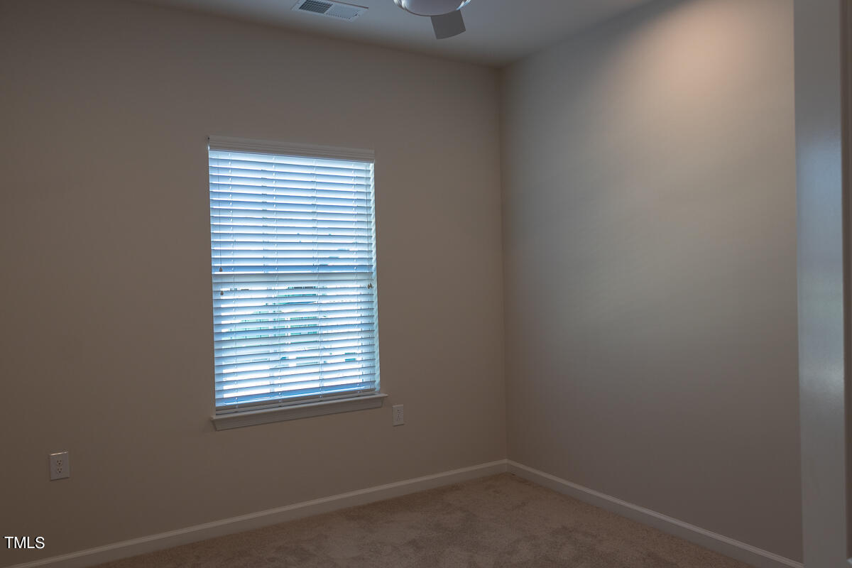 1505 Newpoint Drive Durham, NC 27713 - Photo 32 of 48 an empty room with a window