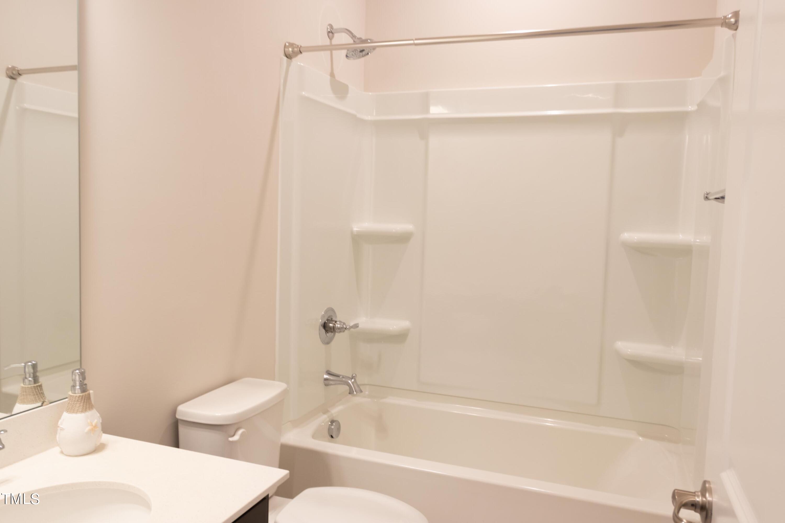 1505 Newpoint Drive Durham, NC 27713 - Photo 35 of 48 a bathroom with a bathtub and a toilet