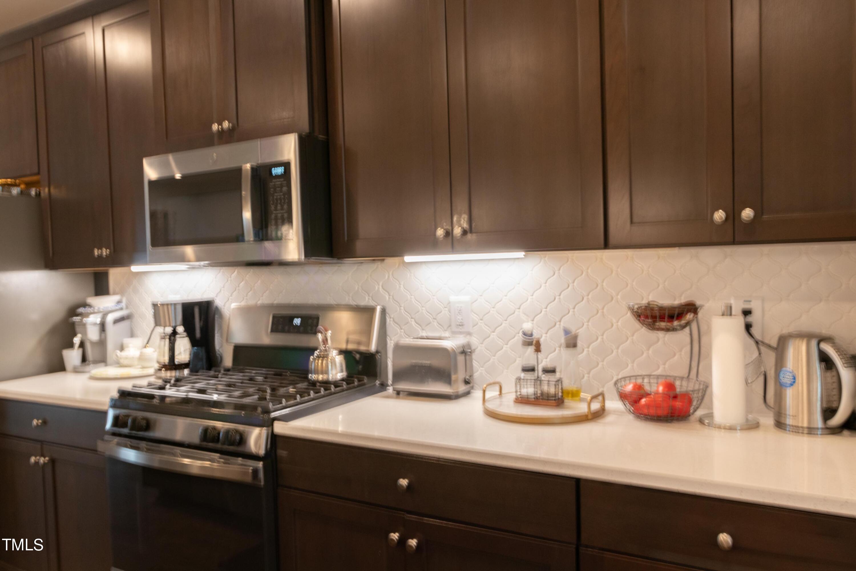 1505 Newpoint Drive Durham, NC 27713 - Photo 6 of 48 a kitchen with a sink and cabinets