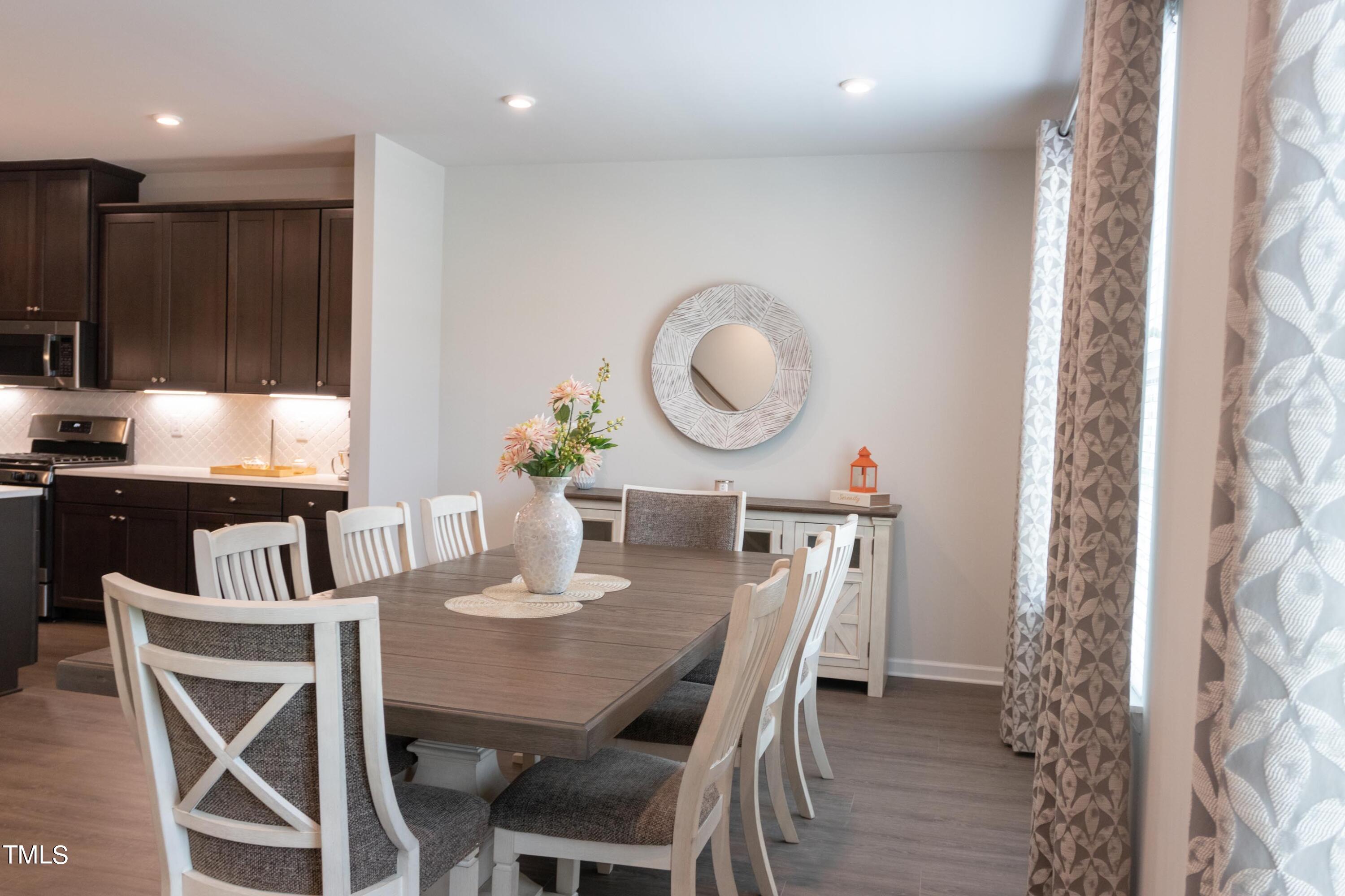 1505 Newpoint Drive Durham, NC 27713 - Photo 8 of 48 a view of a dining room with furniture