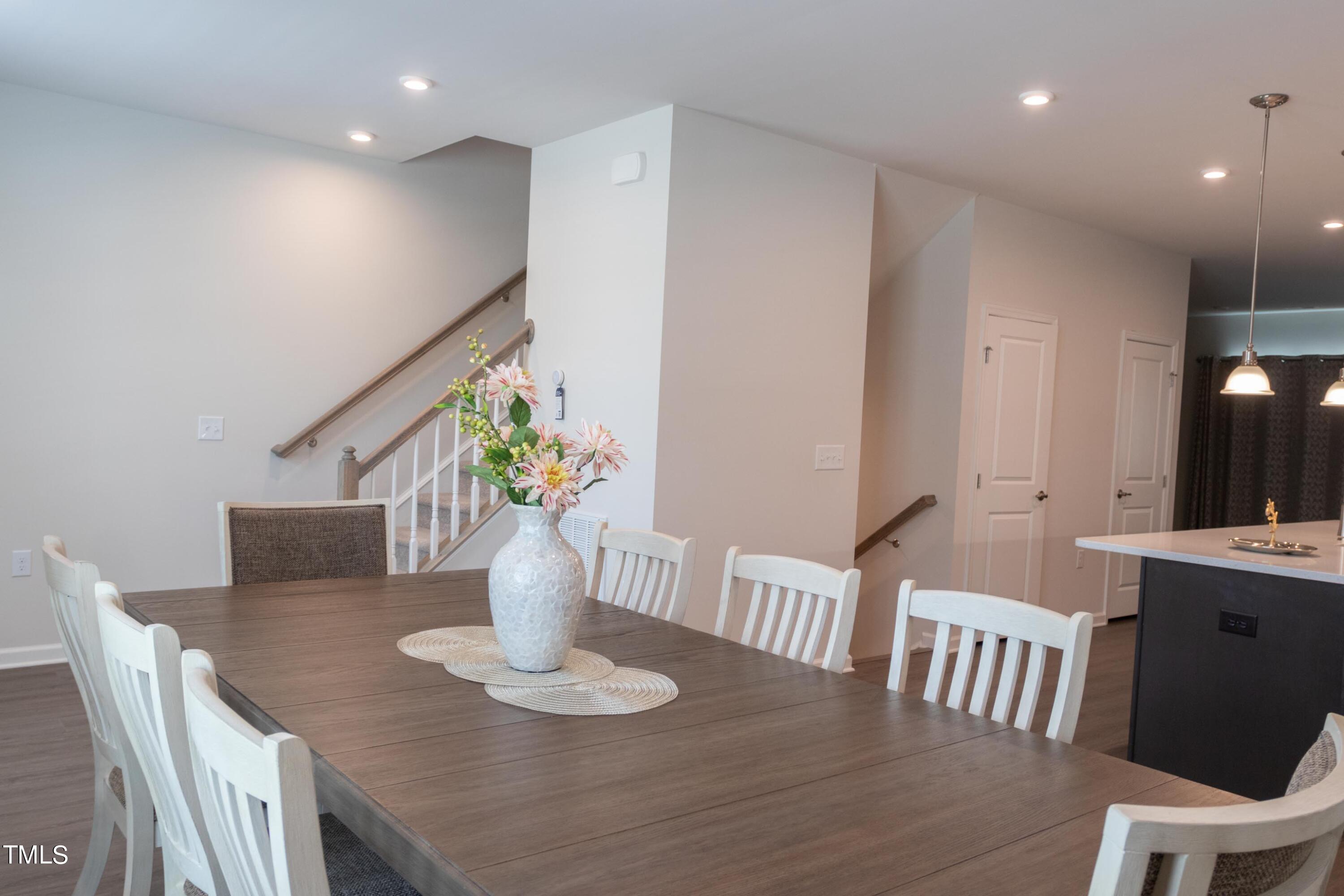 1505 Newpoint Drive Durham, NC 27713 - Photo 9 of 48 a view of a dining room with furniture