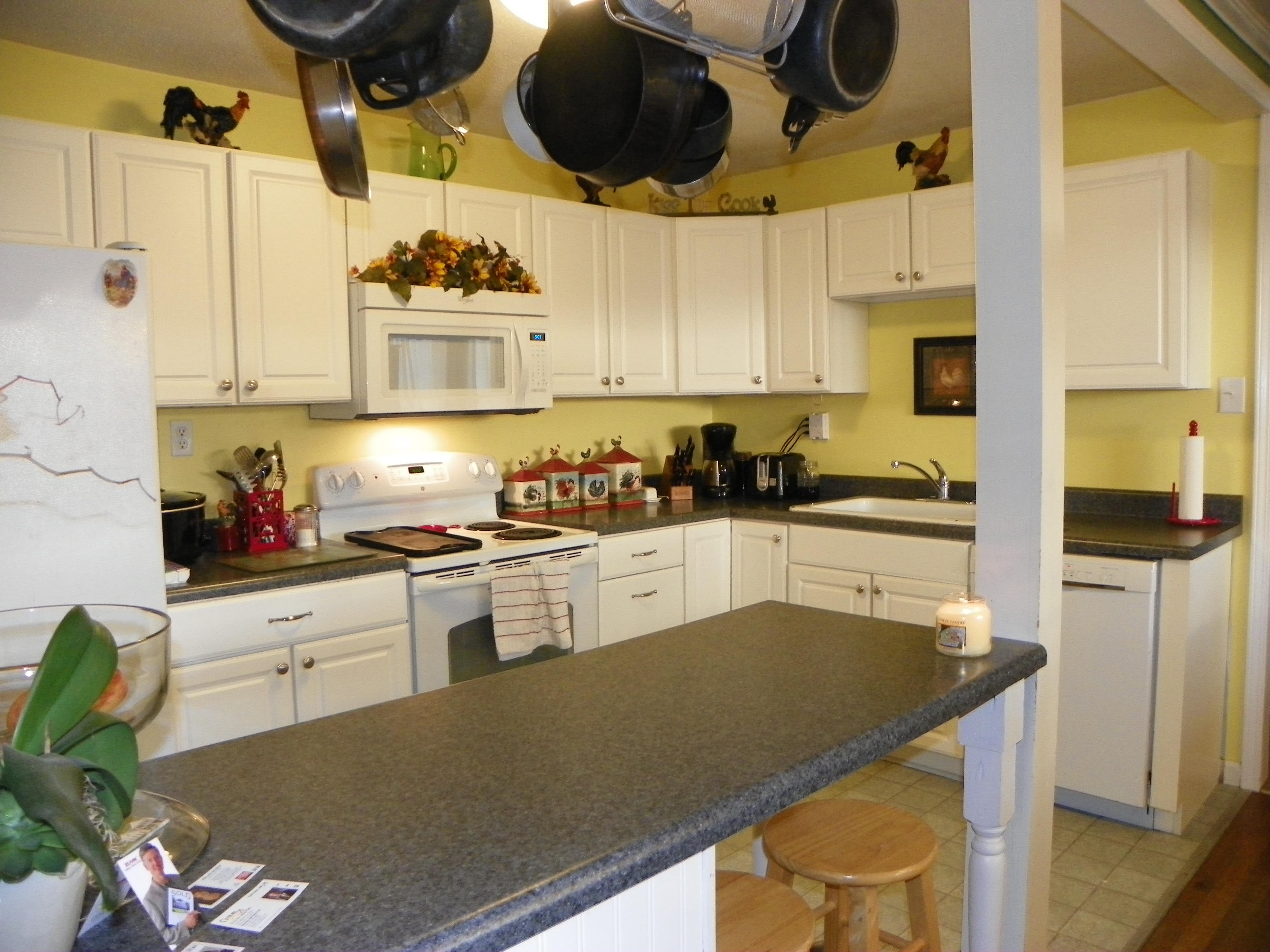 327 Clemons Road Roanoke, VA 24019 - Photo 11 of 35 a kitchen with a stove a sink and a refrigerator