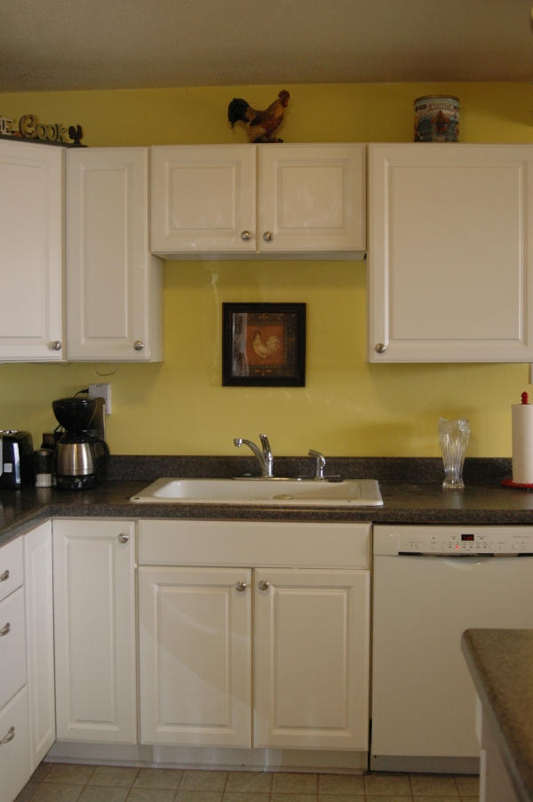 327 Clemons Road Roanoke, VA 24019 - Photo 12 of 35 a kitchen with granite countertop white cabinets and sink