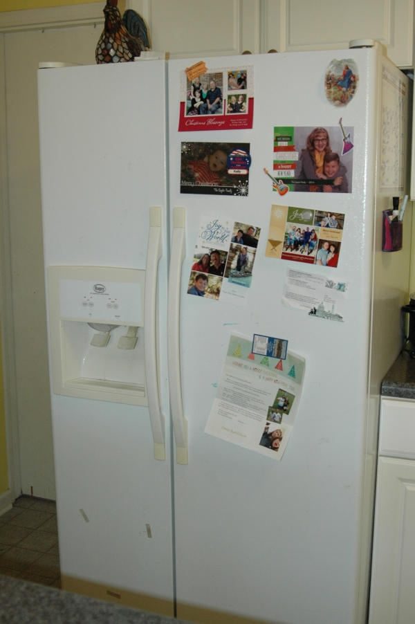327 Clemons Road Roanoke, VA 24019 - Photo 14 of 35 a white refrigerator freezer and a wooden floor