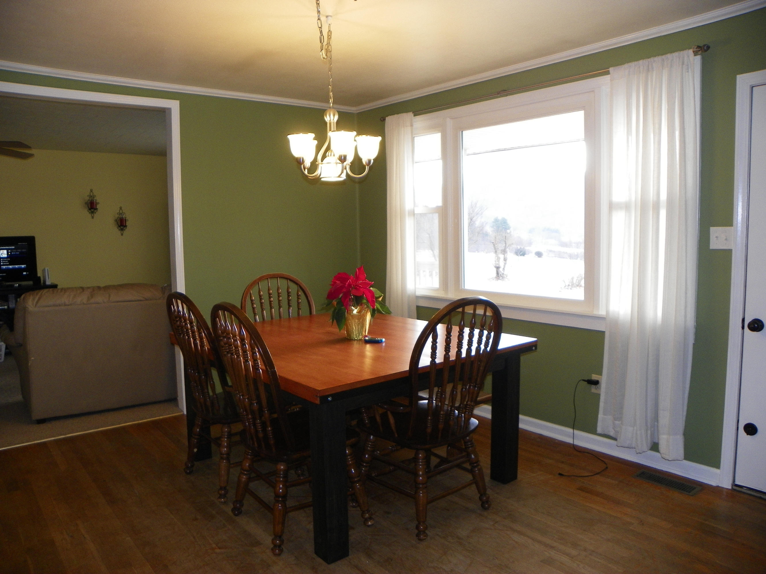 327 Clemons Road Roanoke, VA 24019 - Photo 16 of 35 a view of a dining room with furniture window and wooden floor