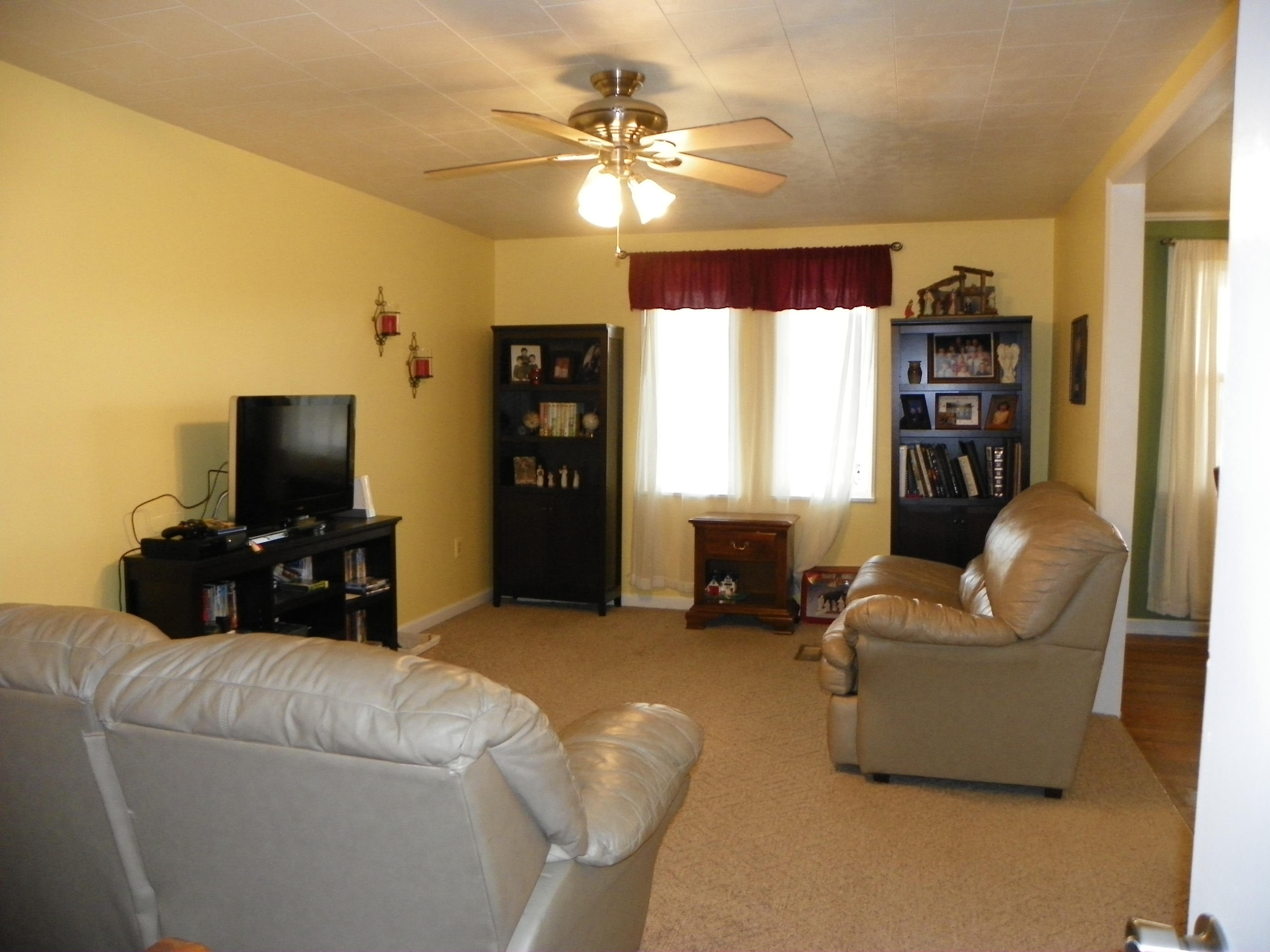 327 Clemons Road Roanoke, VA 24019 - Photo 19 of 35 a living room with furniture and a flat screen tv