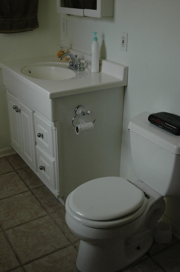 327 Clemons Road Roanoke, VA 24019 - Photo 25 of 35 a white toilet sitting next to a bathroom sink
