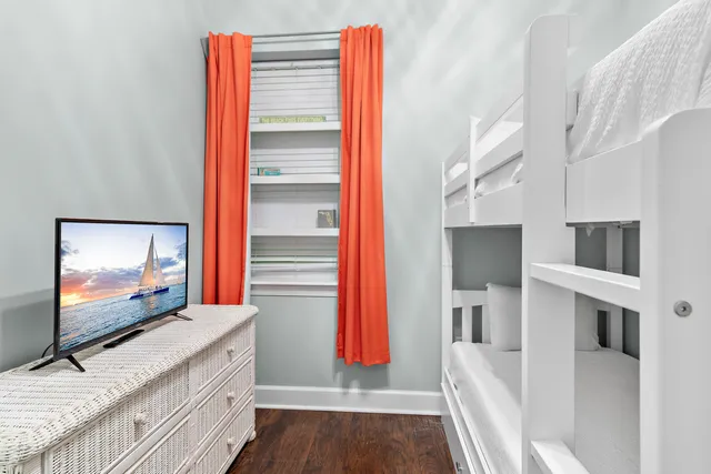 a bathroom with a sink vanity mirror and toilet