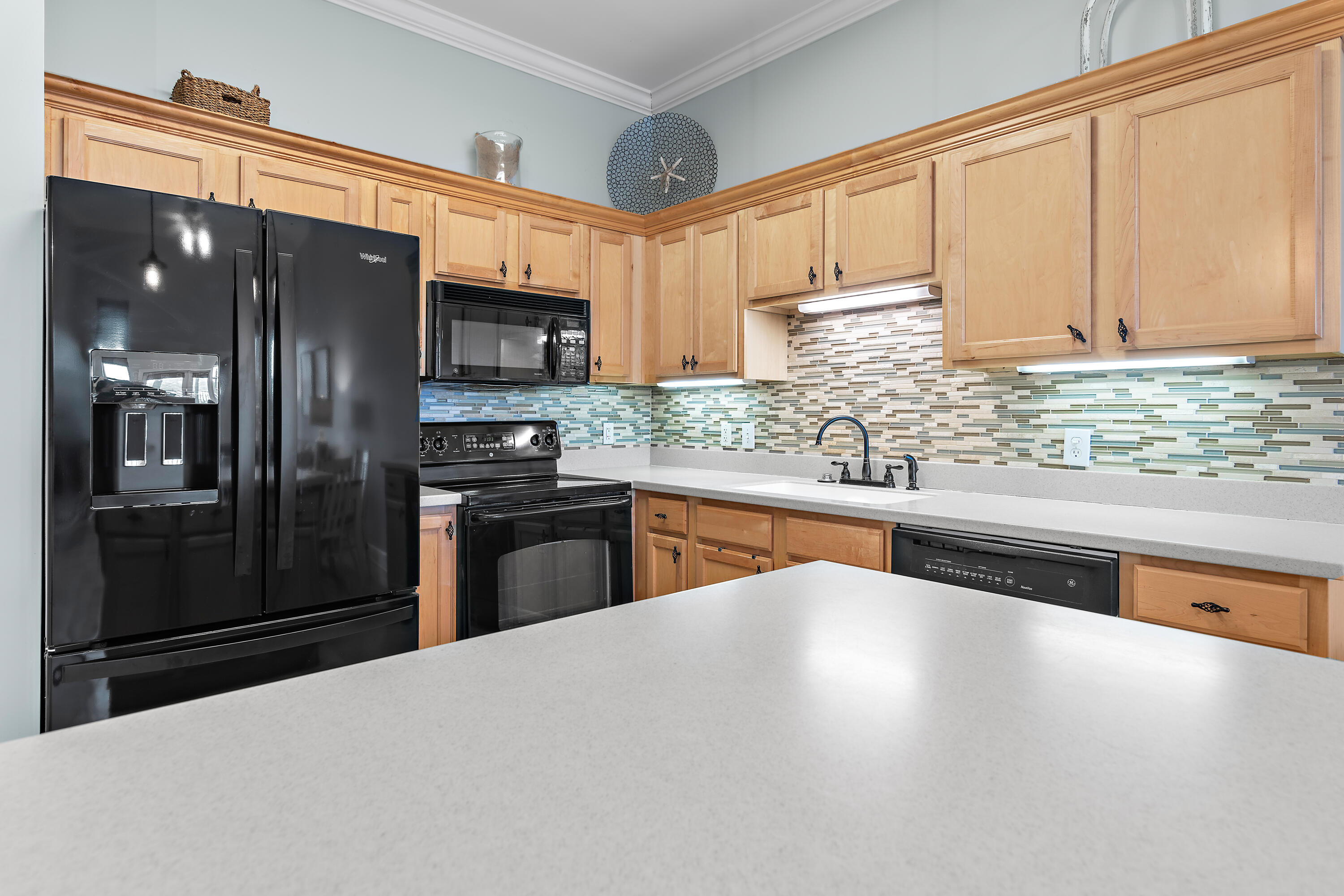 231 Somerset Bridge Road, Unit 2408 Santa Rosa Beach, FL 32459 - Photo 5 of 27 a kitchen with stainless steel appliances granite countertop a refrigerator a stove and a sink with wooden floor