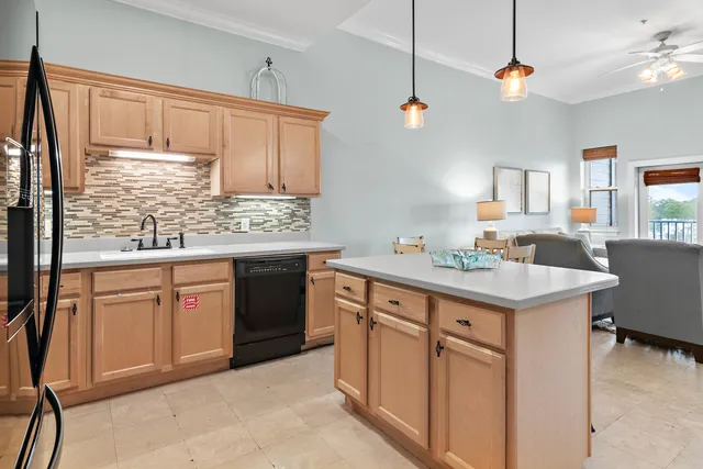 a view of a kitchen with a table and chairs