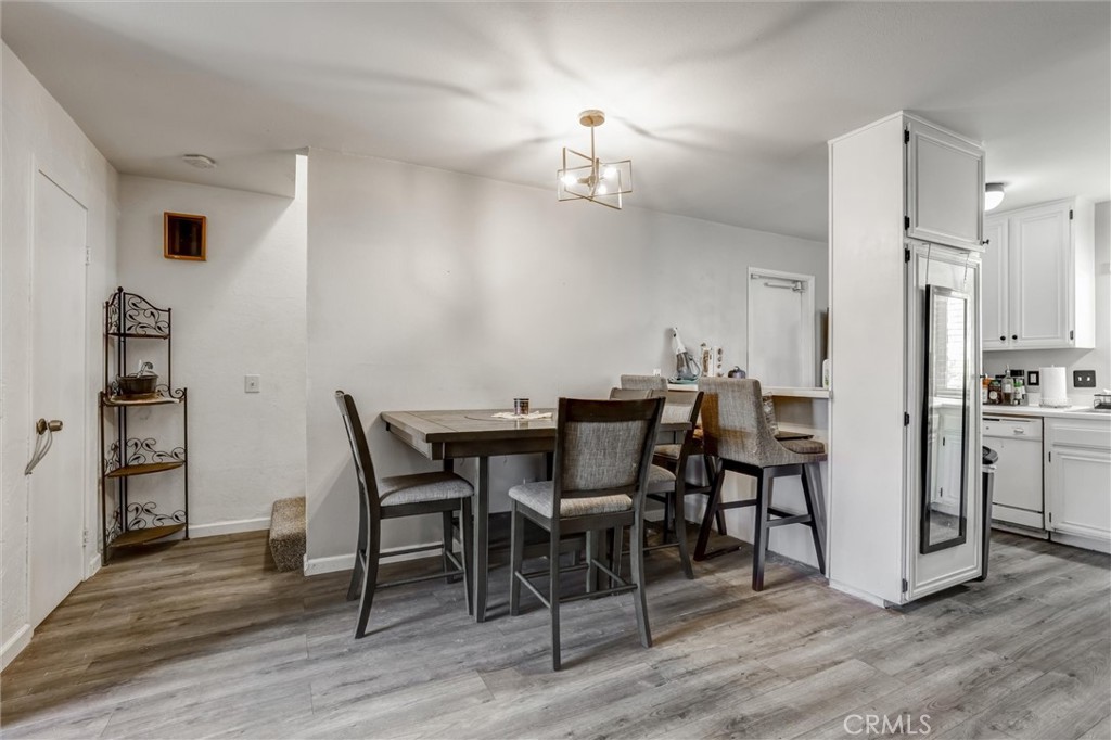 4687 Knickerbocker Lane Riverside, CA 92501 - Photo 5 of 27 a view of a dining room with furniture and wooden floor