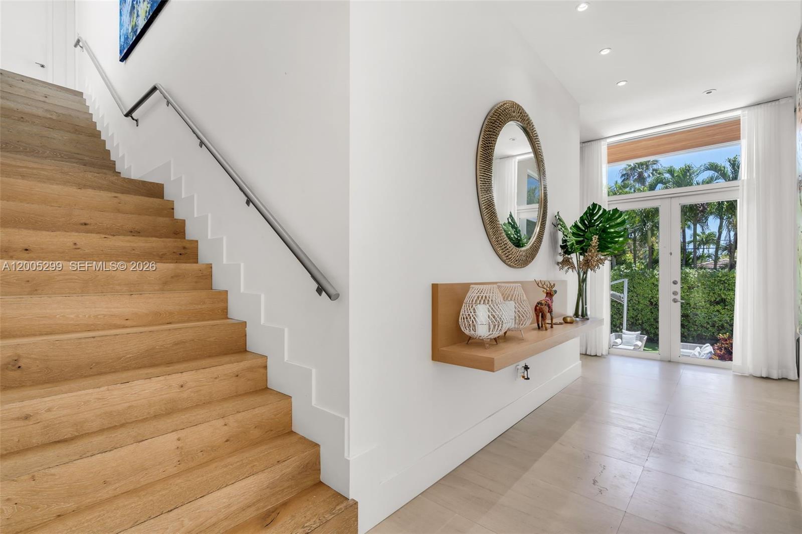 230 West McIntyre Street Key Biscayne, FL 33149 - Photo 21 of 53 a view of entryway with wooden floor and window