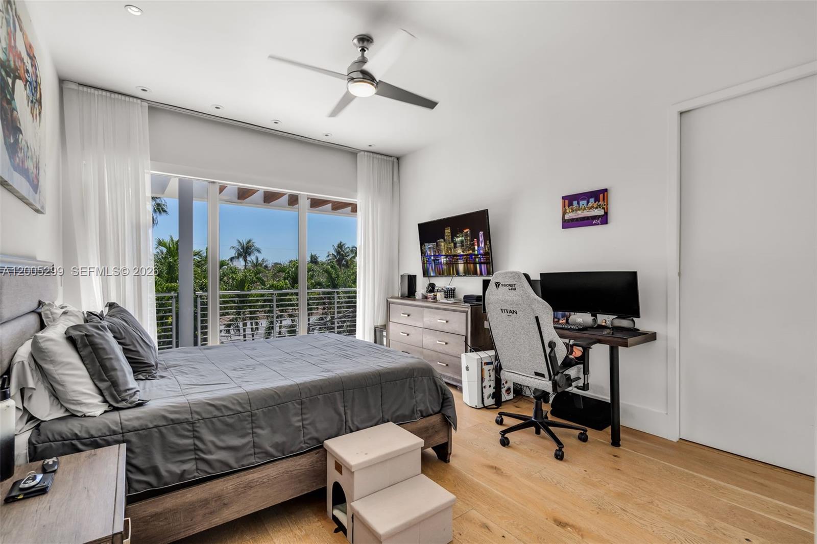 230 West McIntyre Street Key Biscayne, FL 33149 - Photo 35 of 53 a view of a livingroom with workspace and a window