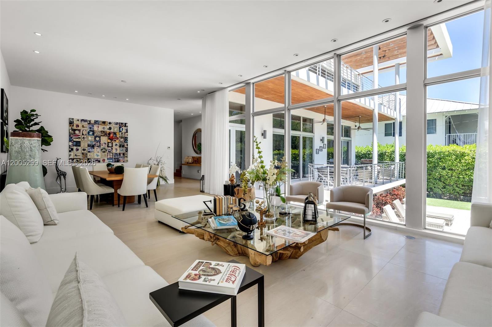 230 West McIntyre Street Key Biscayne, FL 33149 - Photo 4 of 53 a living room with furniture and a large window with balcony view