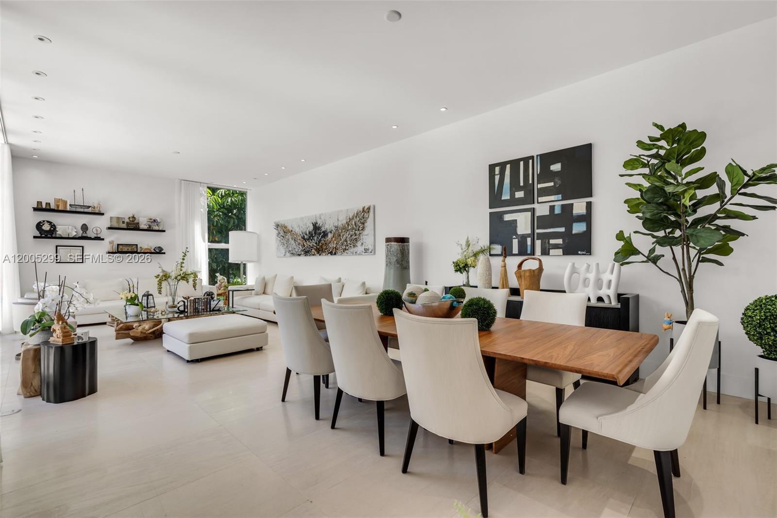 230 West McIntyre Street Key Biscayne, FL 33149 - Photo 8 of 53 a dining room with furniture and a potted plant
