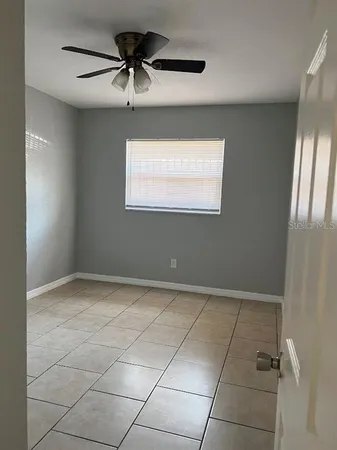 a view of an empty room and a window