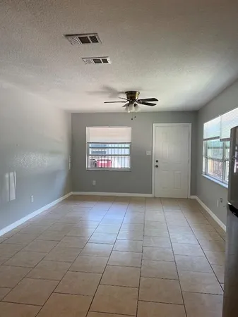 a view of an empty room and window