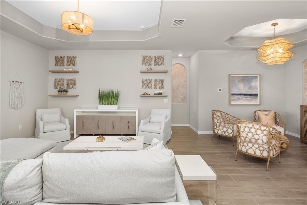 15048 Redbud Lane Punta Gorda, FL 33955 - Photo 11 of 34 a bedroom with a bed and a couch