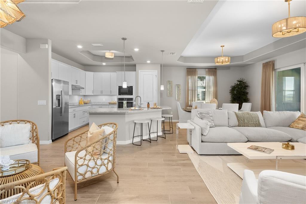 15048 Redbud Lane Punta Gorda, FL 33955 - Photo 13 of 34 a living room with furniture and kitchen view
