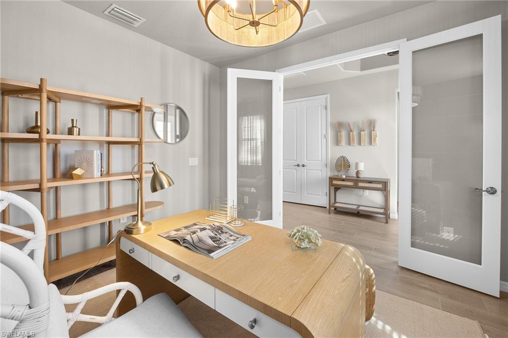 15048 Redbud Lane Punta Gorda, FL 33955 - Photo 16 of 34 a bedroom with a bed and a painting on the wall