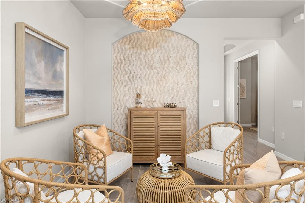 15048 Redbud Lane Punta Gorda, FL 33955 - Photo 17 of 34 a living room with furniture and a chandelier