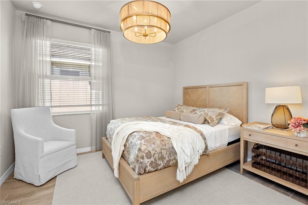 15048 Redbud Lane Punta Gorda, FL 33955 - Photo 21 of 34 a bedroom with a bed and a window