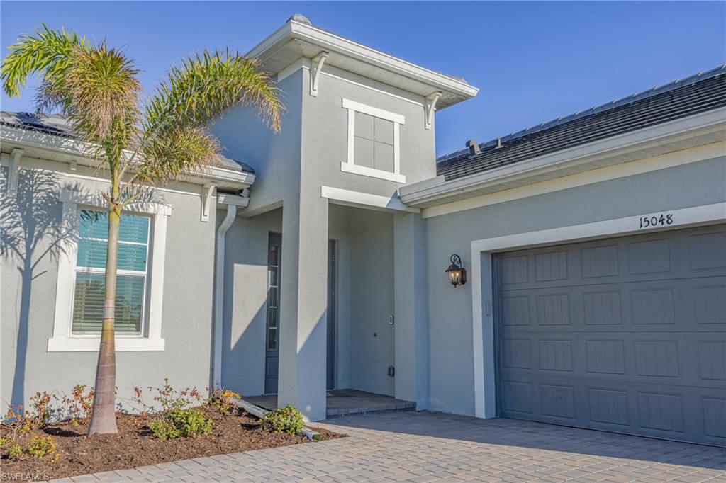 15048 Redbud Lane Punta Gorda, FL 33955 - Photo 27 of 34 a front view of a house with a yard